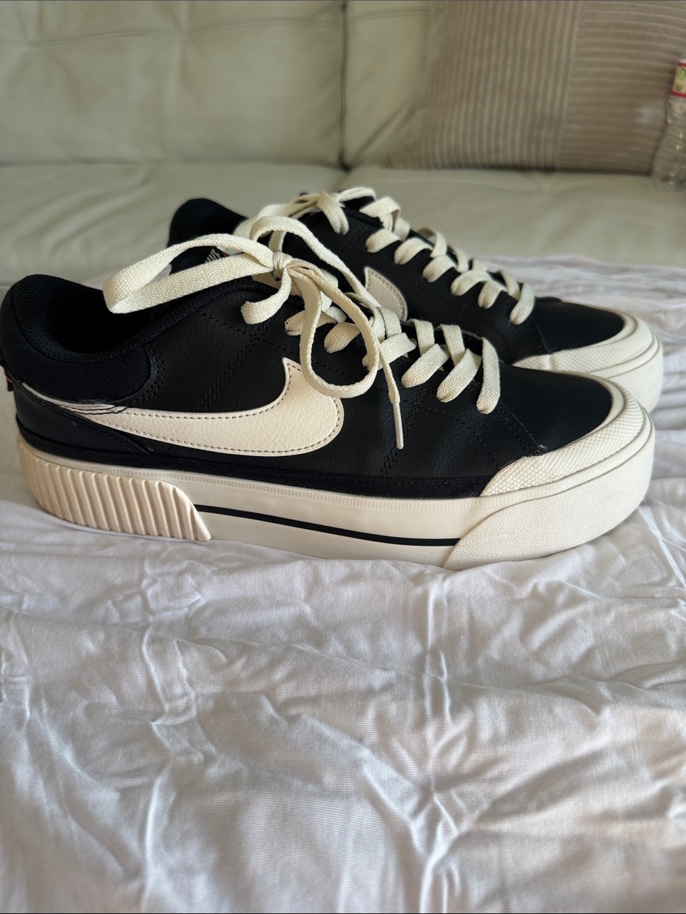 Nike Black Sneakers with Cream Accents - Good Condition